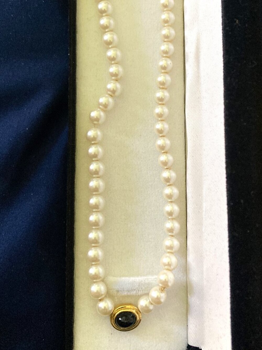Vintage Faux Pearl Necklace Featuring A Gold-Tone Pendant With A Black Stone